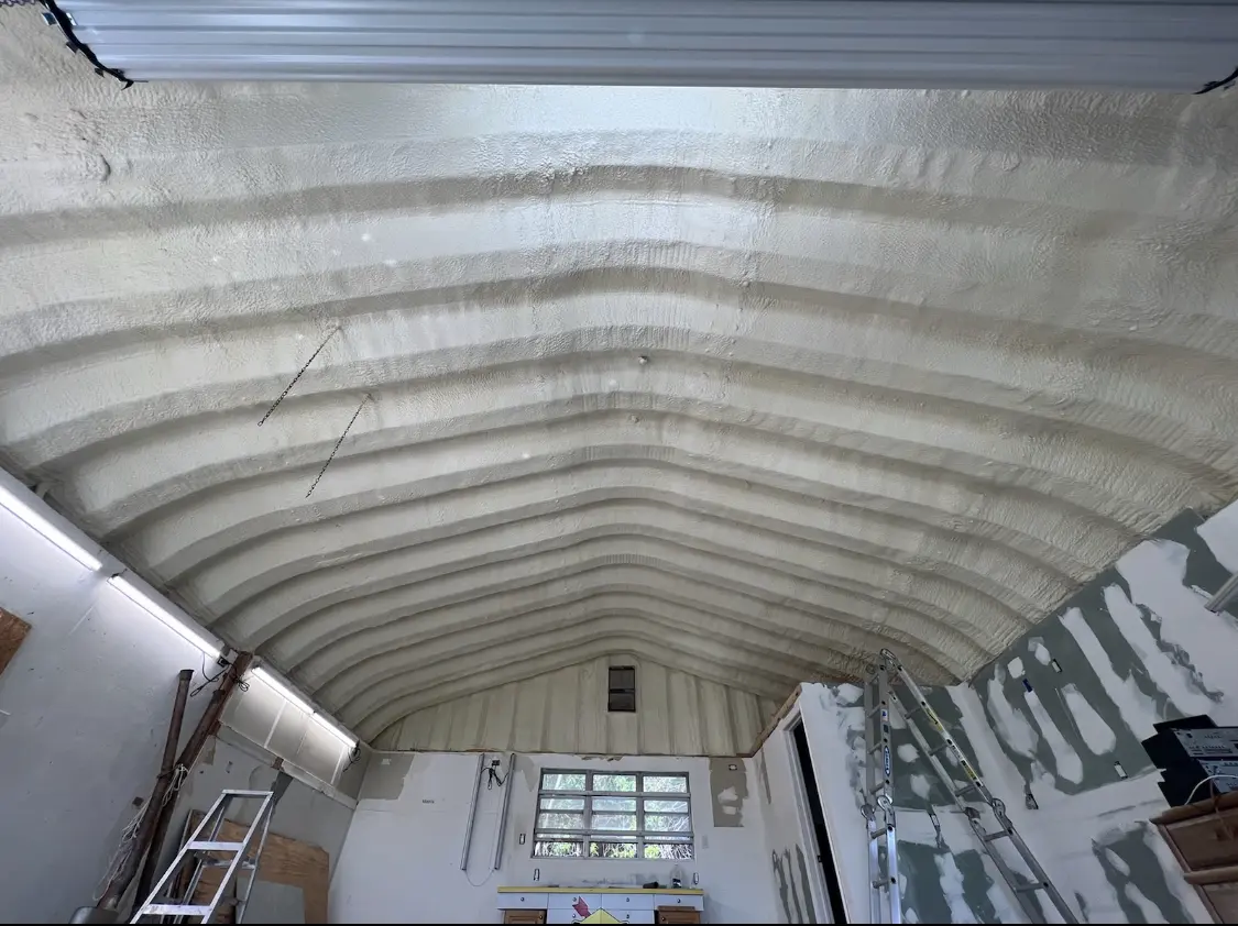 Spray polyurethane foam applied to the underside of a metal roof deck in Bartow